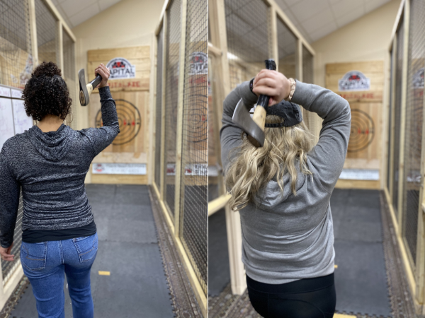 individuals throwing axes at a target