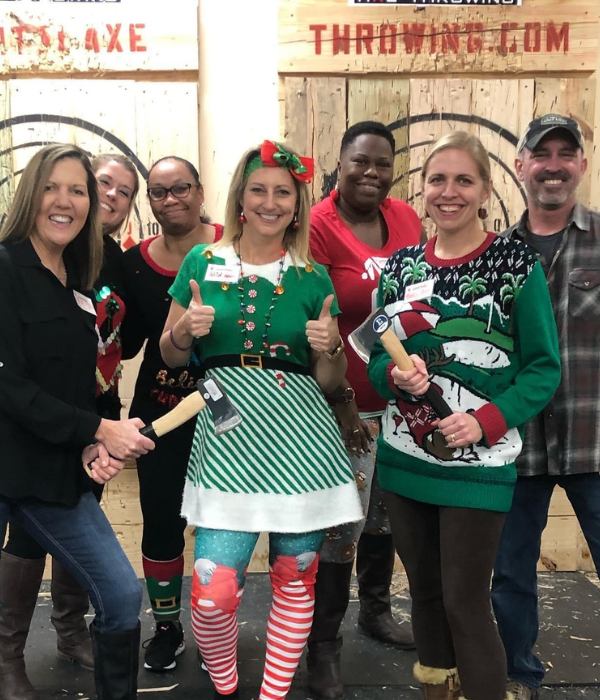 A group of adults celebrating a holiday party at Capital Axe Throwing